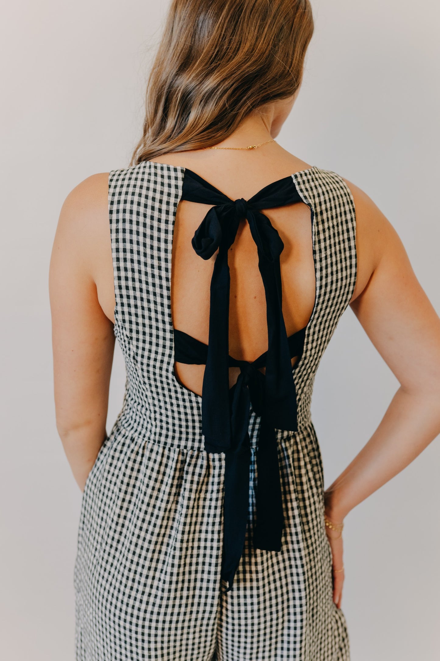 Miou Muse | Gingham Tie in Back Jumpsuit | Black