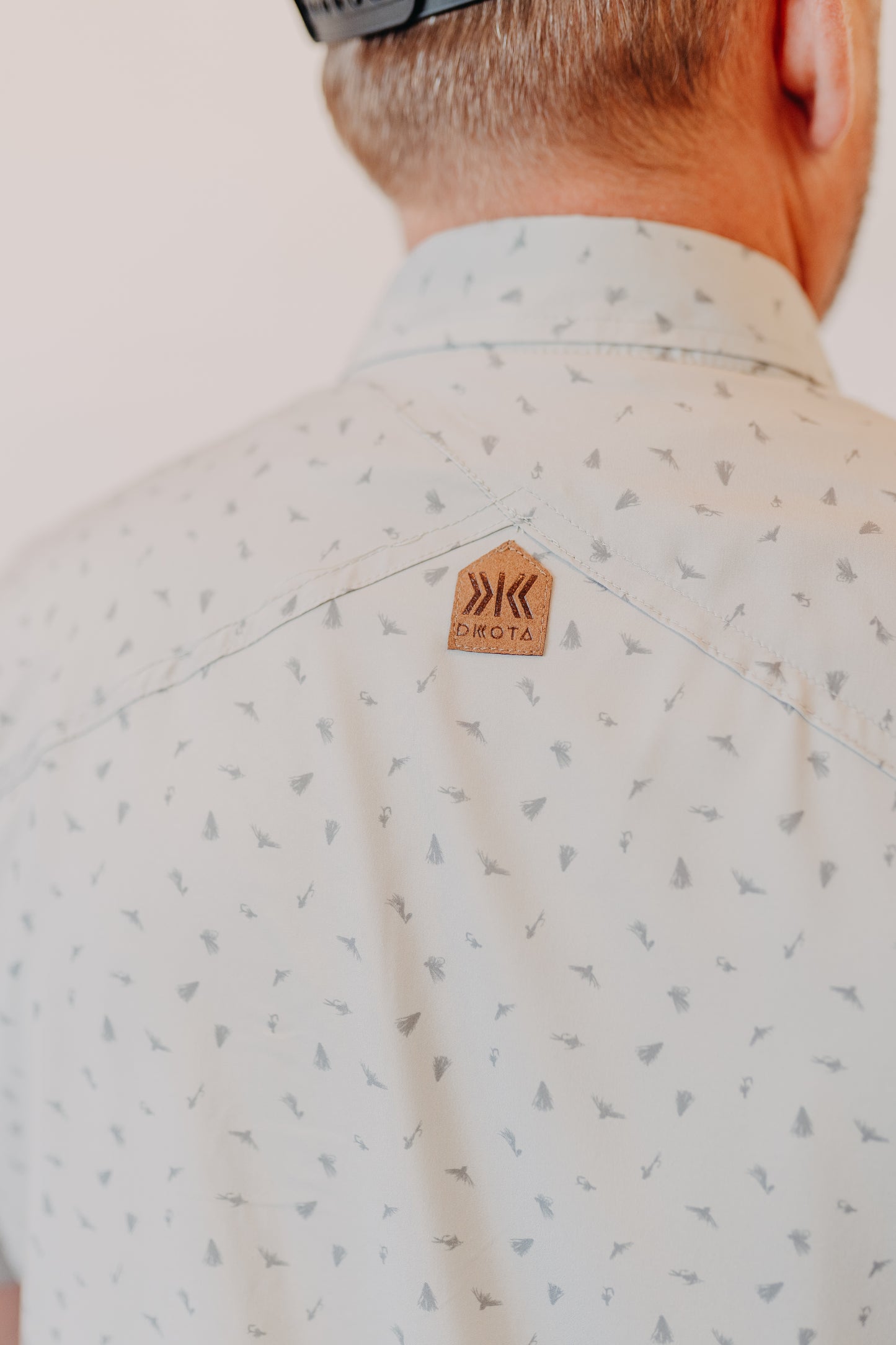 Dkota Grizzly | Reel Scattered Fly Print Top | Pebble Drift