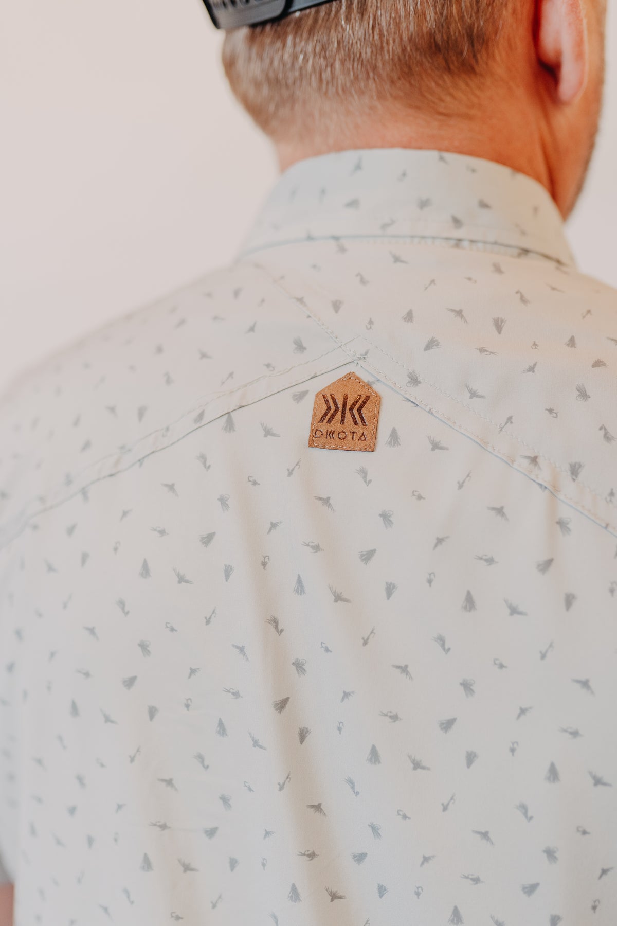 Dkota Grizzly | Reel Scattered Fly Print Top | Pebble Drift
