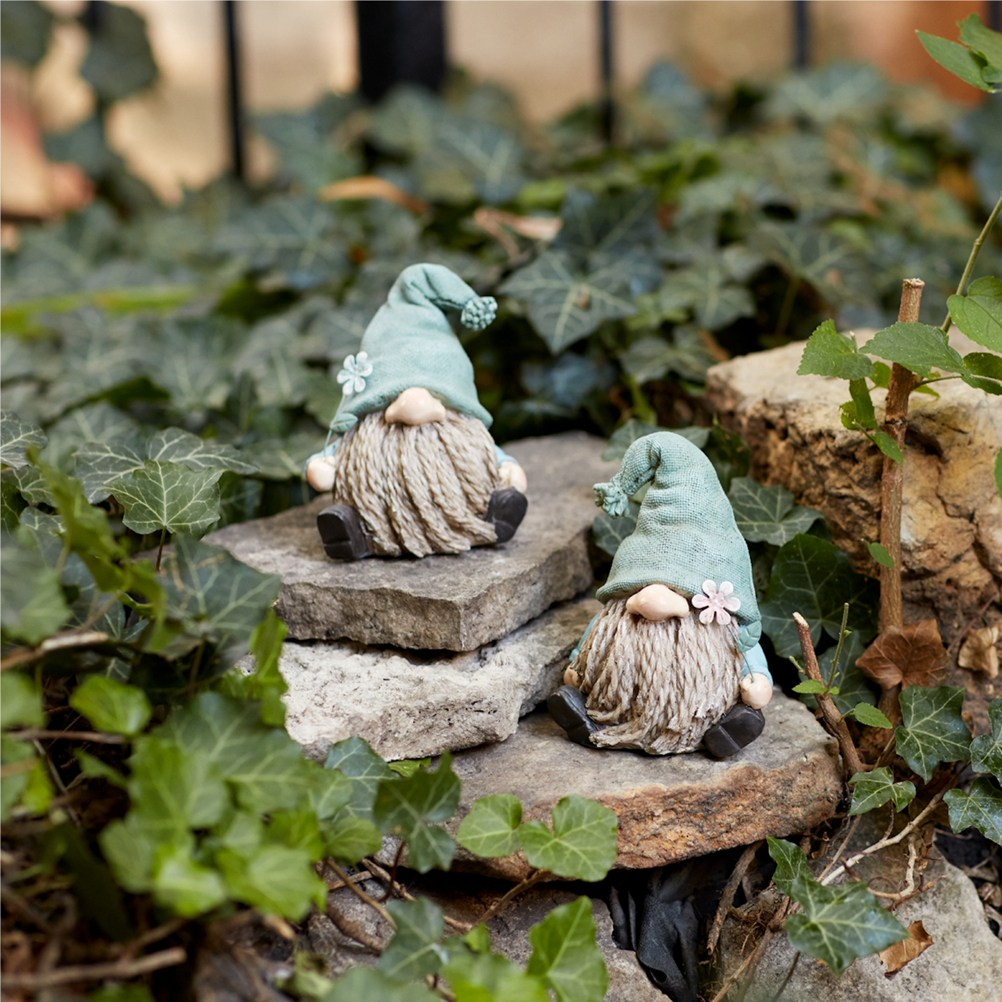 Stone Garden Gnome Figurine with Flower Stem Accent (Set of 4)